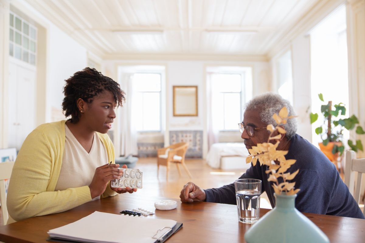 Care worker providing gentle personal care and daily living support at home